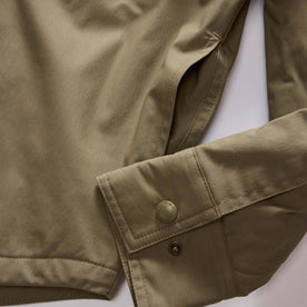 material shot of the snap cuffs on The Lined Maritime Shirt Jacket in Olive