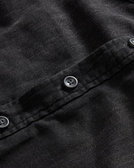 material shot of the buttons on The Lined Utility Shirt in Washed Black Denim, Wovens by Taylor Stitch