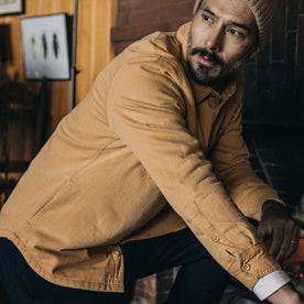 fit model kneeling in The Lined Utility Shirt in Wheat Denim