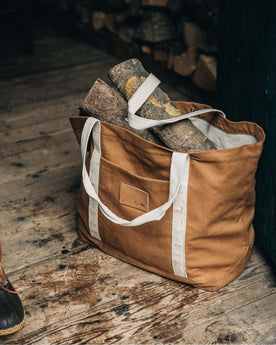 The Market Tote in Cedar Boss Duck with some logs inside, Accessories by Taylor Stitch