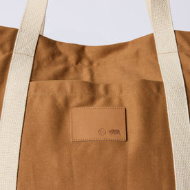 material shot of the Taylor Stitch leather patch on The Market Tote in Cedar Boss Duck