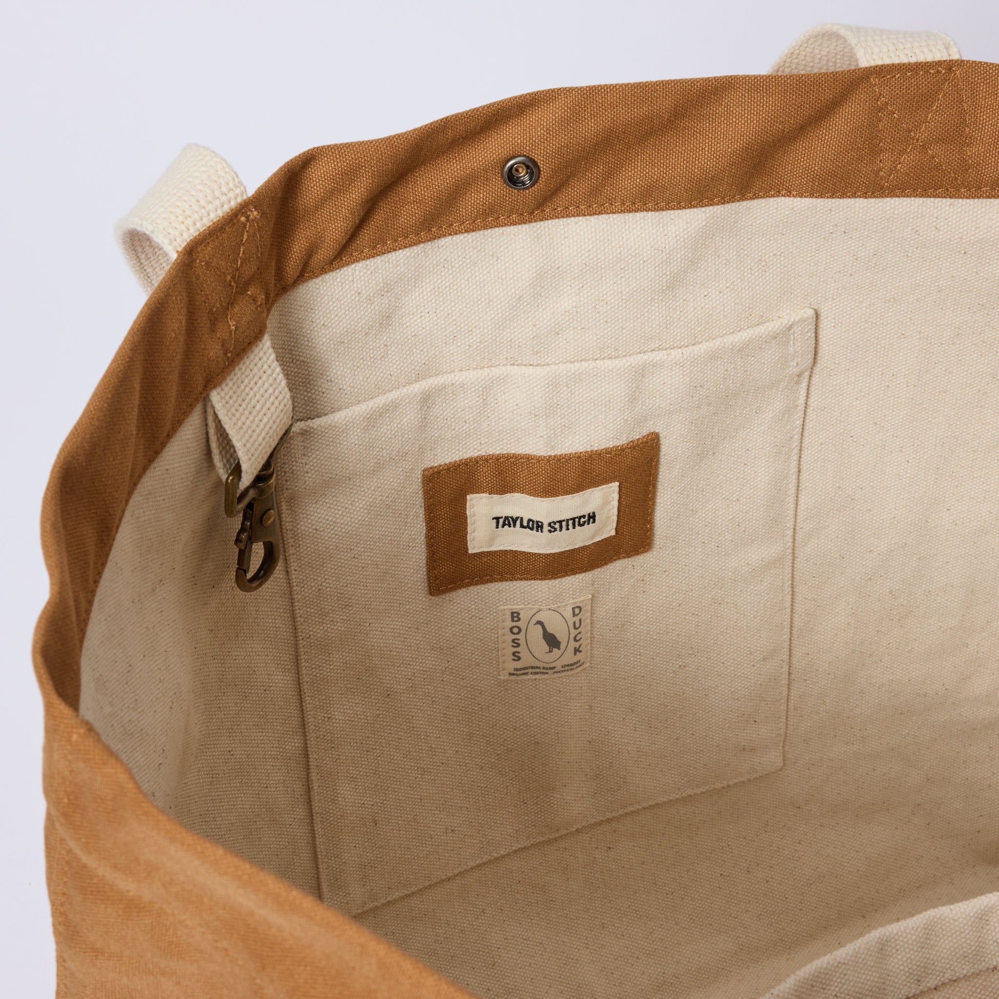 material shot of the interior pocket and keyhook on The Market Tote in Cedar Boss Duck, Accessories by Taylor Stitch