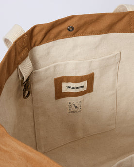 material shot of the interior pocket and keyhook on The Market Tote in Cedar Boss Duck, Accessories by Taylor Stitch
