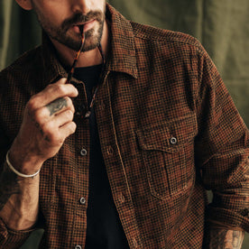 fit model showing the front of The Saddler Shirt in Dark Roast Plaid Cord