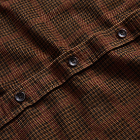 material shot of the buttons on The Saddler Shirt in Dark Roast Plaid Cord