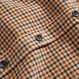 material shot of the buttons on The Saddler Shirt in Teak Plaid Cord