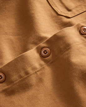 material shot of the buttons on The Shop Shirt in Cedar Boss Duck, Wovens by Taylor Stitch