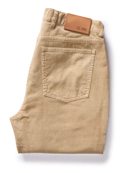flatlay of The Slim All Day Pant in Light Khaki Cord, shown folded from back, Bottoms by Taylor Stitch