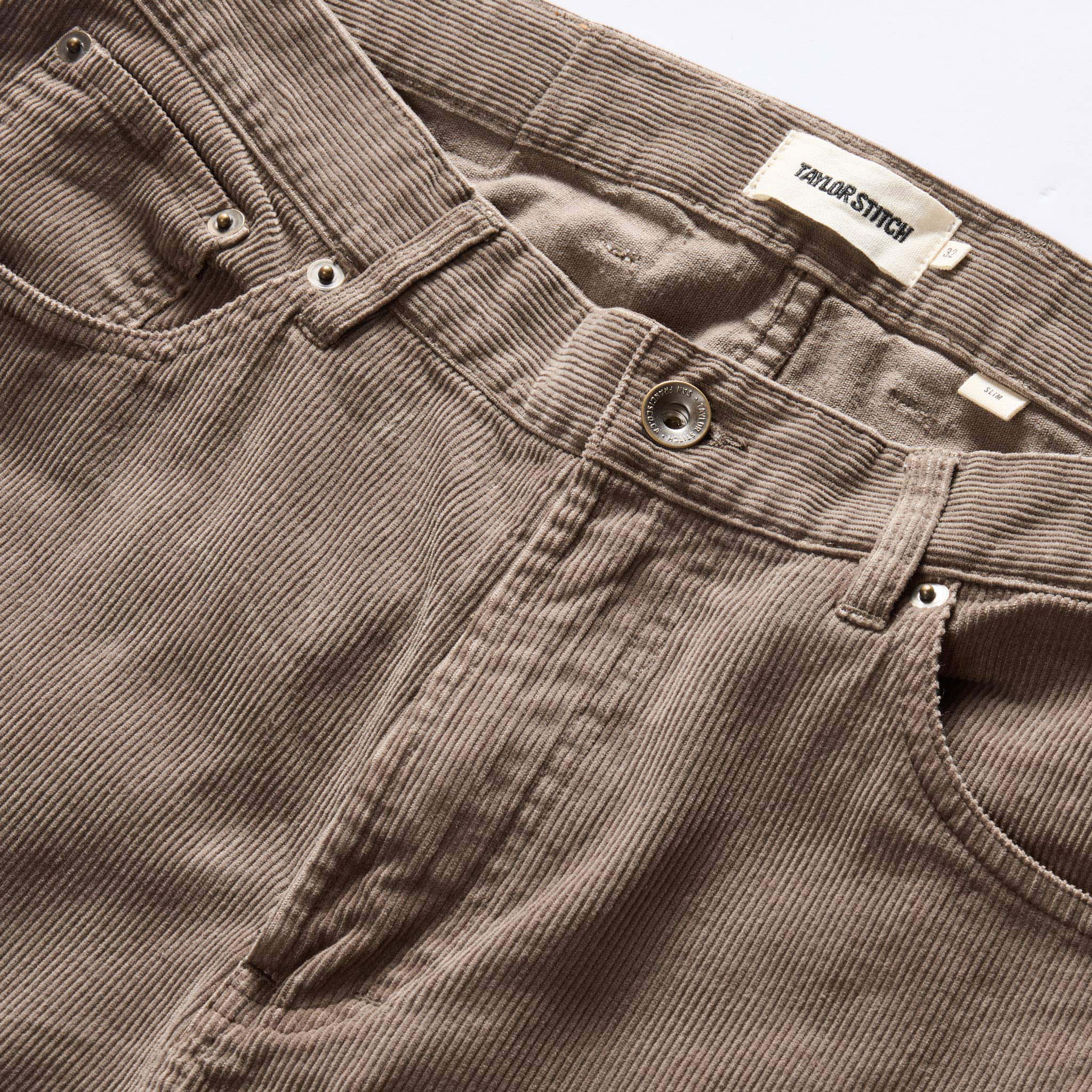 material shot of the button fly on The Slim All Day Pant in Morel Cord, Bottoms by Taylor Stitch