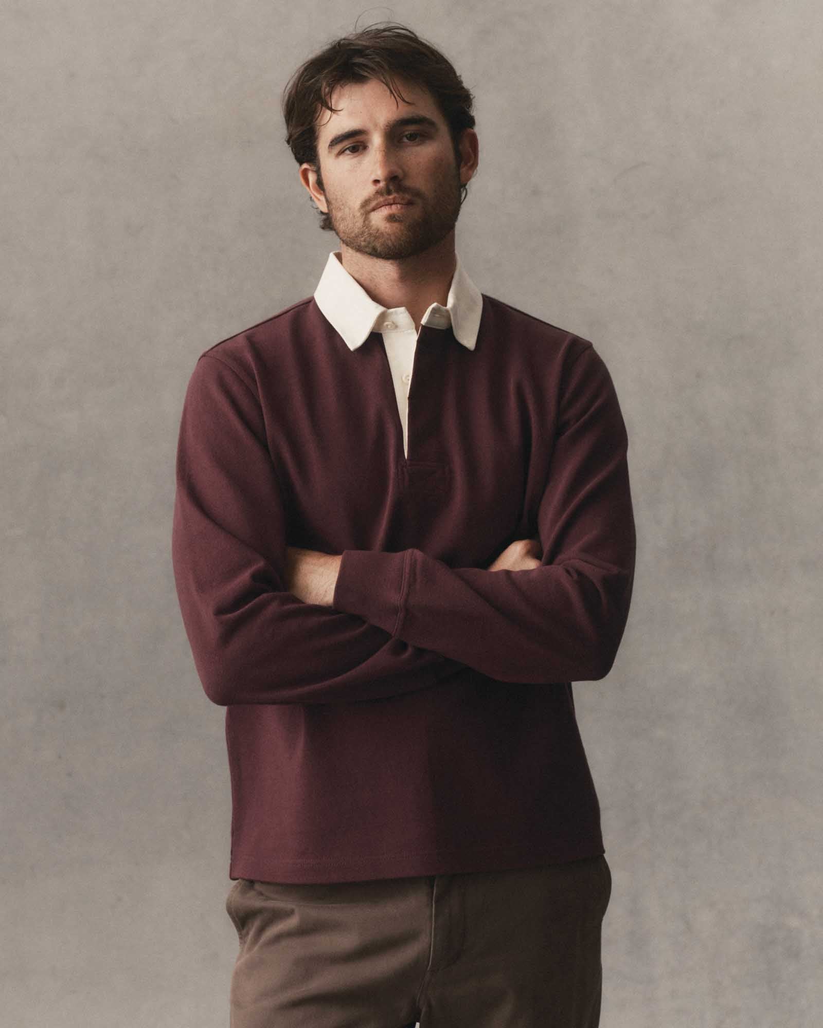 fit model with his arms crossed wearing The Rugby Shirt in Burgundy, Knits by Taylor Stitch