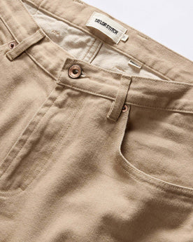 material shot of the button fly on The Democratic All Day Pant in Light Khaki Broken Twill, Bottoms by Taylor Stitch