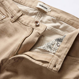 material shot of the zipper fly on The Democratic All Day Pant in Light Khaki Broken Twill