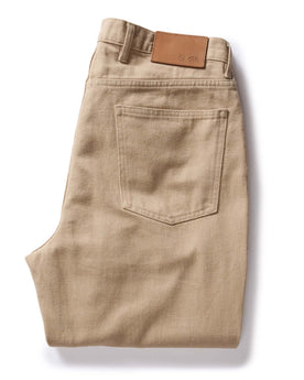 flatlay of The Democratic All Day Pant in Light Khaki Broken Twill, folded from back, Bottoms by Taylor Stitch