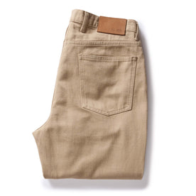 flatlay of The Democratic All Day Pant in Light Khaki Broken Twill, folded from back