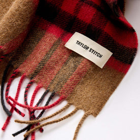 material shot of the TS label on The Fireside Scarf in Camel Tartan Merino