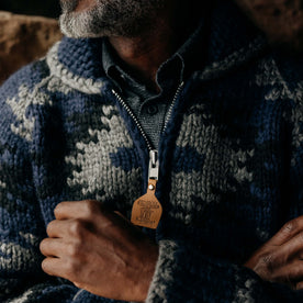 fit model showing the front of The Seawall Hand-Knit Sweater in Navy Kilim
