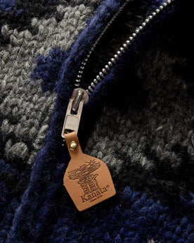 material shot of the leather zipper tab on The Seawall Hand-Knit Sweater in Navy Kilim, Knits by Taylor Stitch