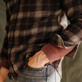 fit model showing the cuffs on The Maritime Shirt Jacket in Burgundy Plaid