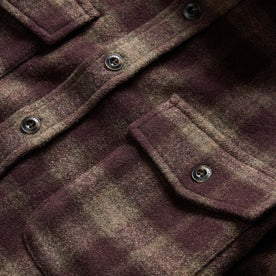 material shot of the front chest pockets on The Maritime Shirt Jacket in Burgundy Plaid