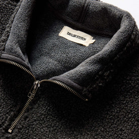 material shot of the collar on The Nomad Pullover in Charcoal Heather Sherpa