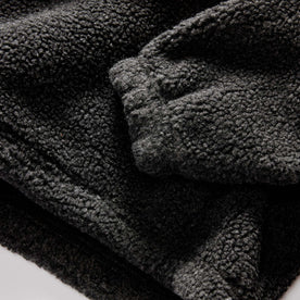 material shot of the sleeve on The Nomad Pullover in Charcoal Heather Sherpa