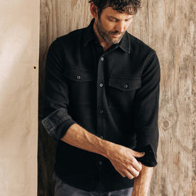 fit model adjusting the sleeves in The Point Shirt in Coal Sashiko