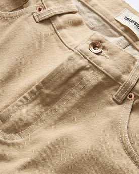 material shot of the button fly on The Slim All Day Pant in Light Khaki Broken Twill, Bottoms by Taylor Stitch
