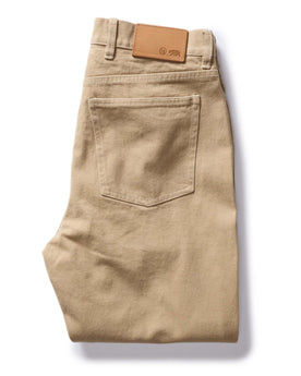 flatlay of The Slim All Day Pant in Light Khaki Broken Twill, folded from back, Bottoms by Taylor Stitch