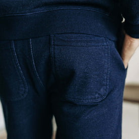 fit model showing the back pockets on The Sunset Pant in Indigo Terry