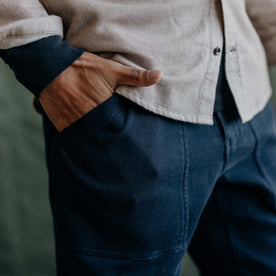 fit model showing the front pockets on The Trail Pant in Dark Navy Bedford Cord