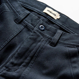 material shot of the button fly on The Trail Pant in Dark Navy Bedford Cord