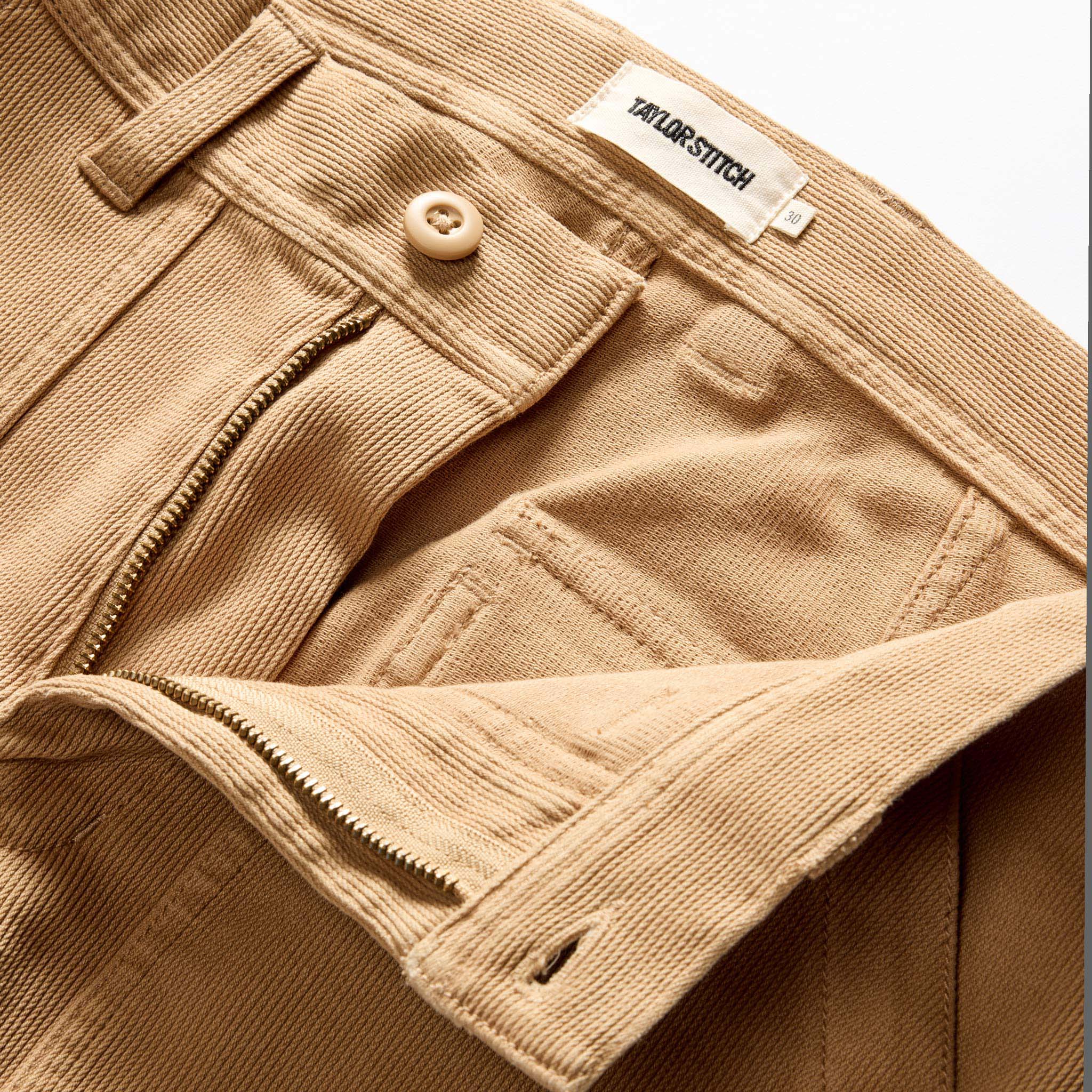 material shot of the zipper fly on The Trail Pant in Light Khaki Bedford Cord, Bottoms by Taylor Stitch