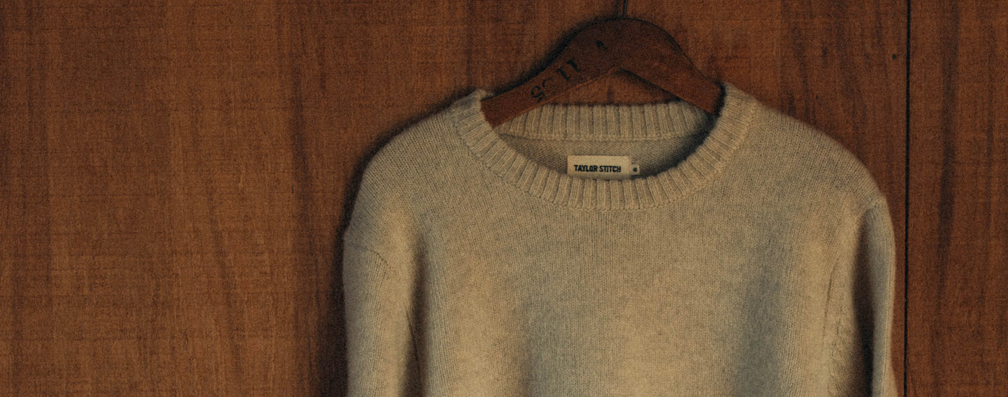 editorial image of The Eastmoor Sweater in Heather Ivory Wool hanging,  by Taylor Stitch