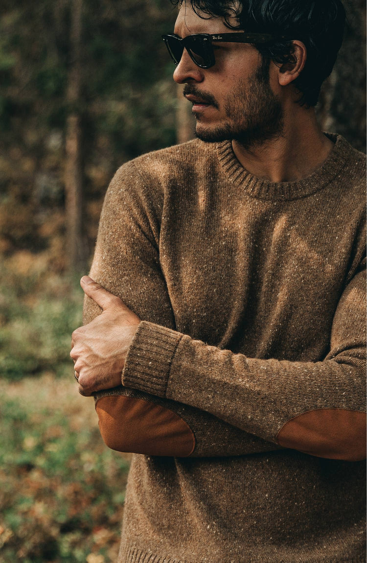 The Hardtack Sweater in Oak Donegal — Model crossing arms and looking over shoulder