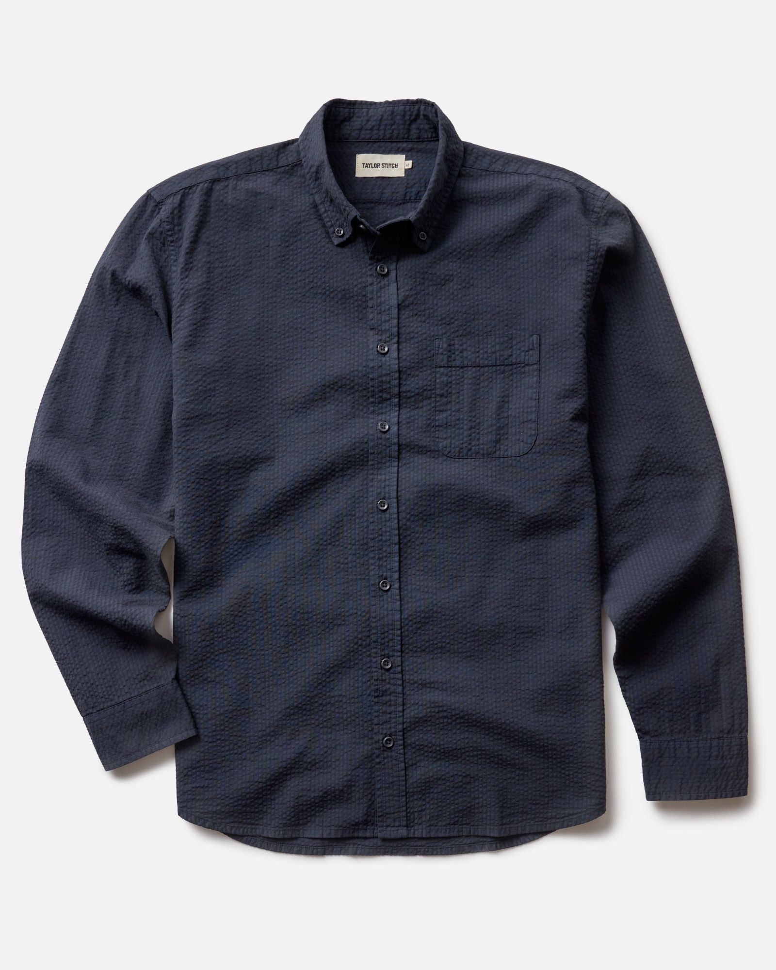full flatlay of The Jack in Dark Navy Seersucker, Wovens by Taylor Stitch