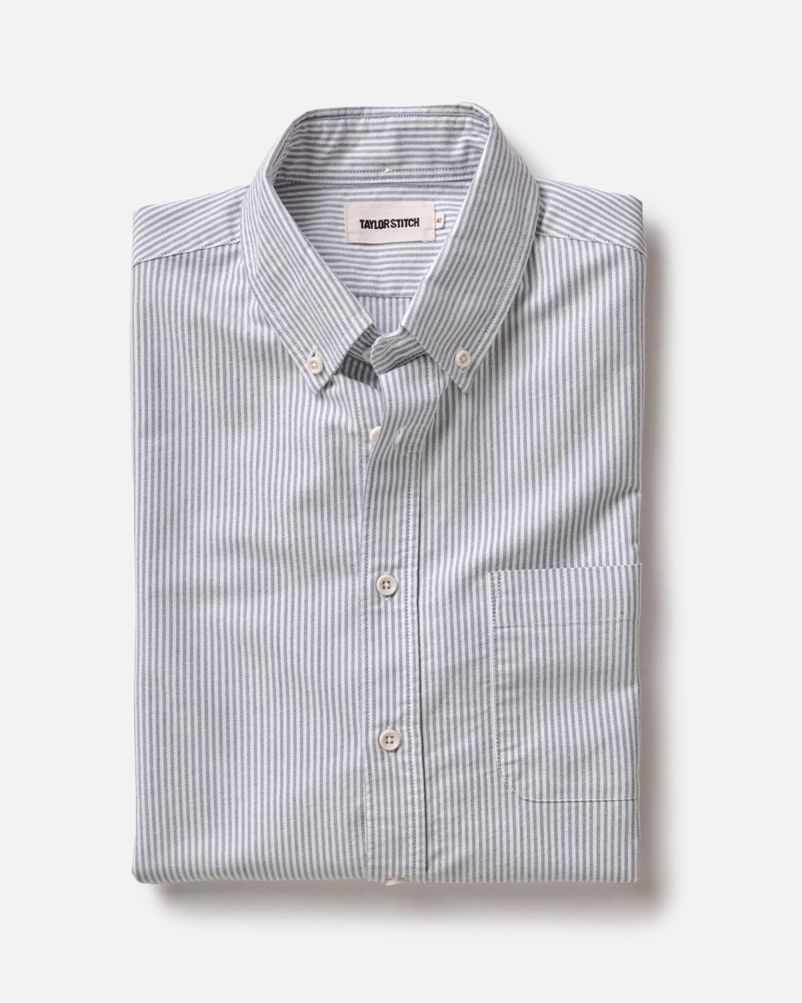 folded flatlay of The Jack in Navy University Stripe Everyday Oxford, Wovens by Taylor Stitch