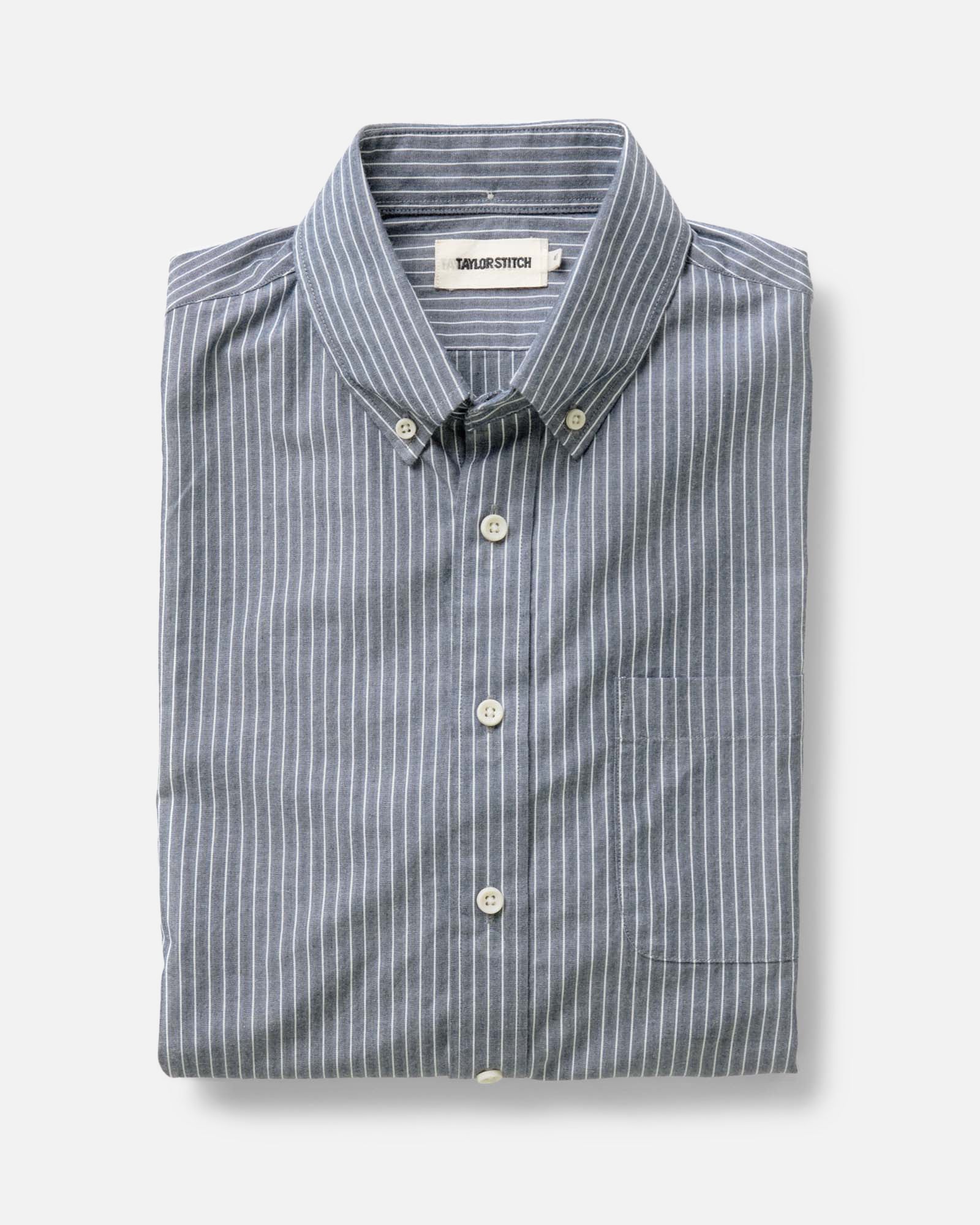 folded flatlay of The Jack in Rinsed Indigo Stripe, Wovens by Taylor Stitch