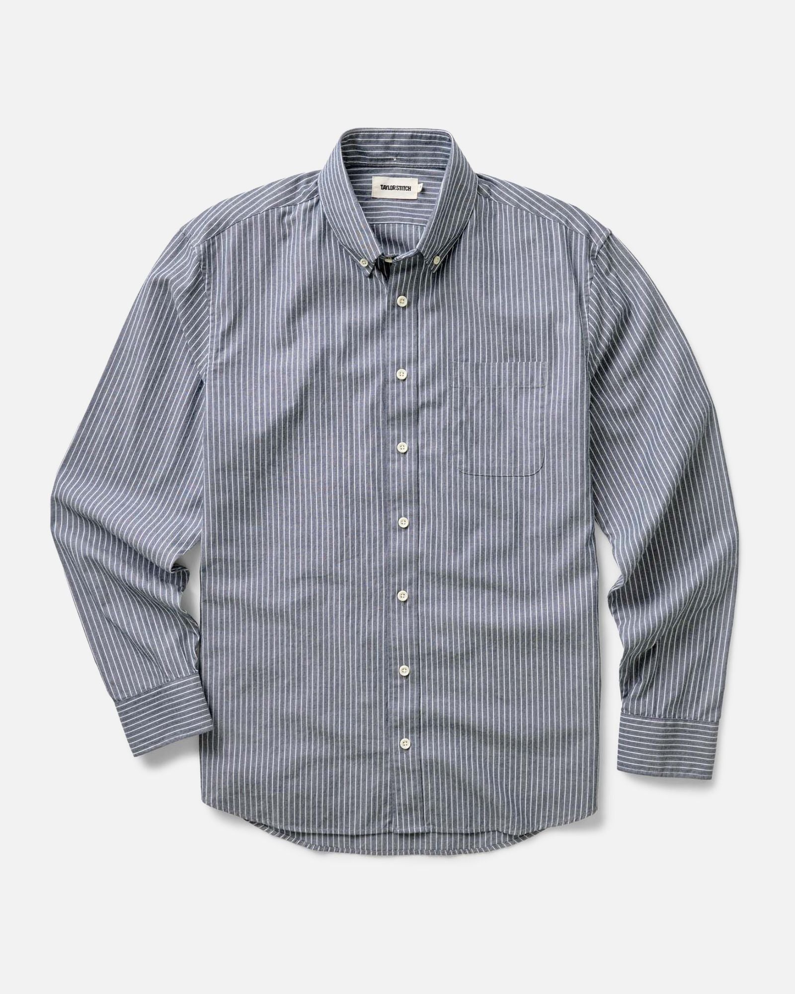 fit model with his arms crossed wearing The Jack in Rinsed Indigo Stripe, Wovens by Taylor Stitch