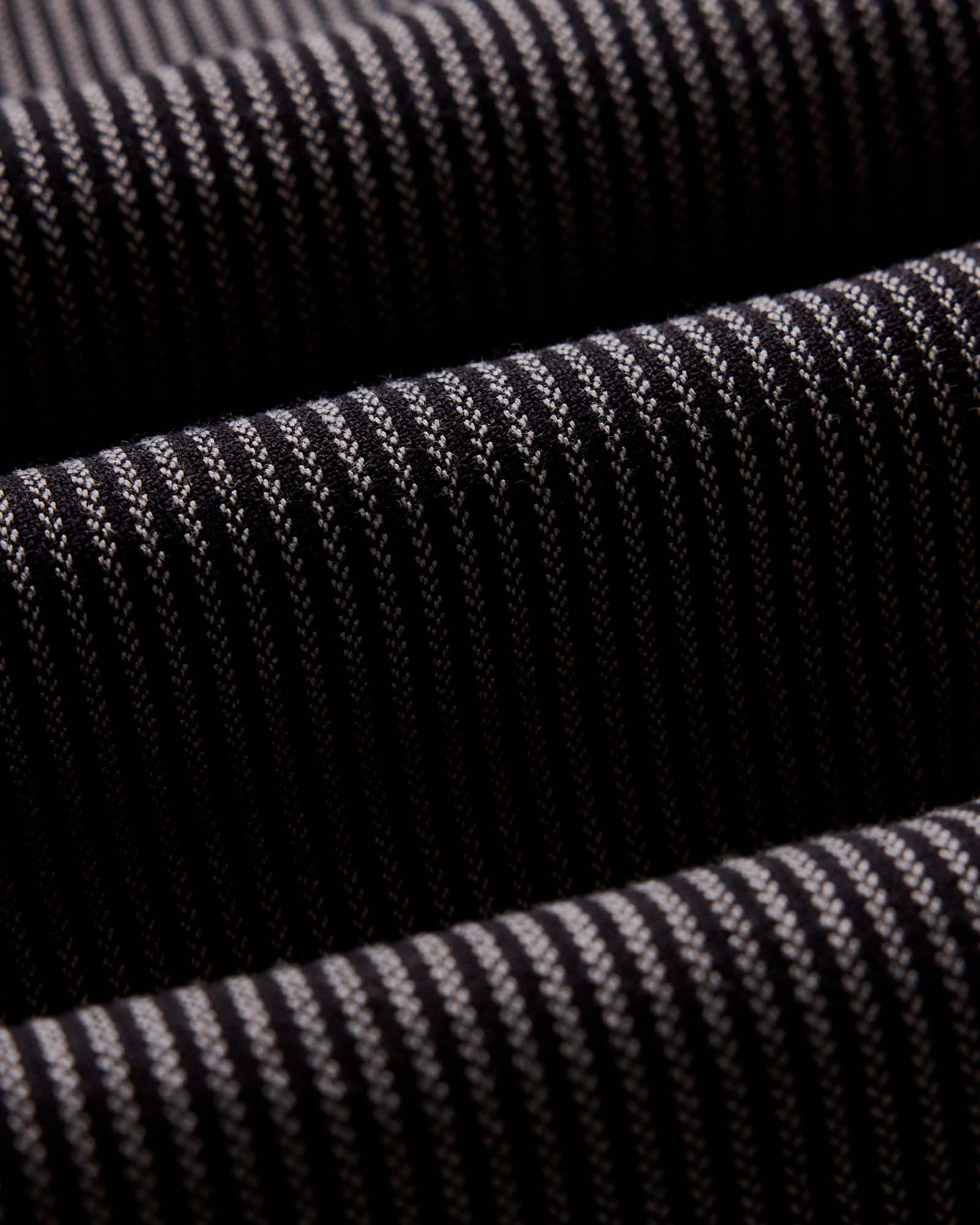 material shot of the back button on the collar on The Jack in Roped Black Indigo, Wovens by Taylor Stitch