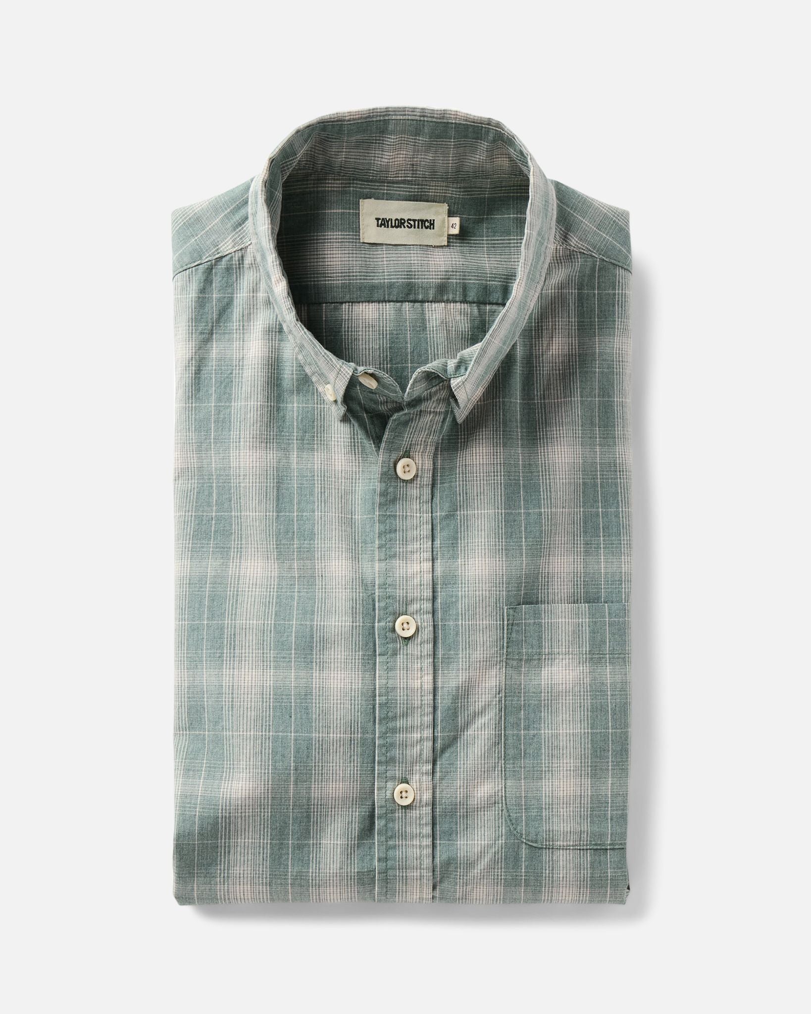 folded flatlay of The Jack in Sea Moss Plaid, Wovens by Taylor Stitch