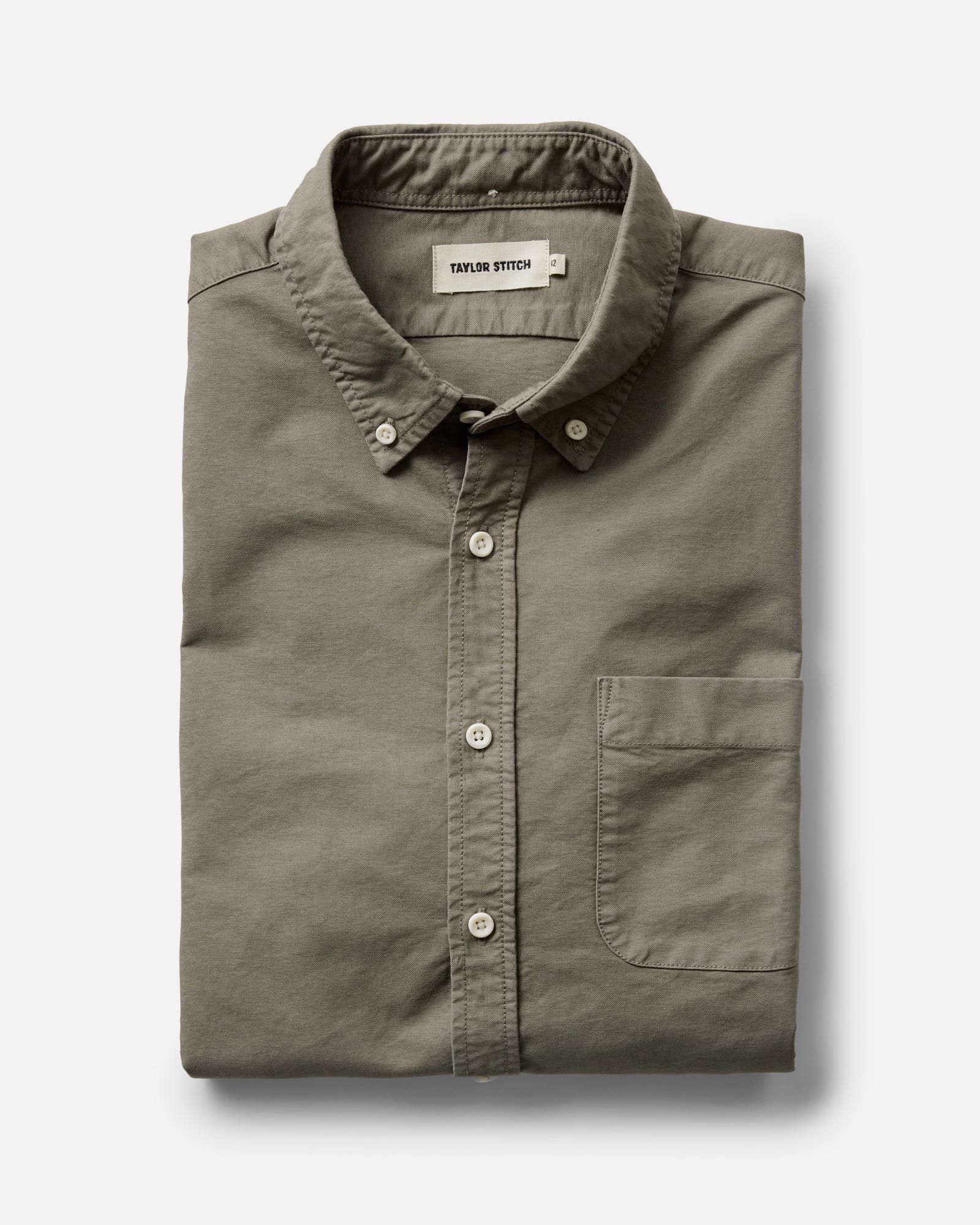 folded flatlay of The Jack in Smoked Olive Oxford, Wovens by Taylor Stitch