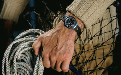 Model wearing the Timex Viscount while holding rope