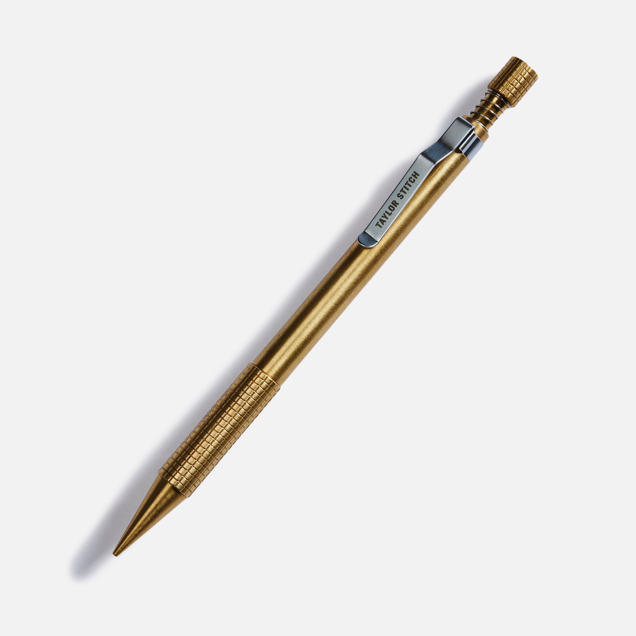 flatlay of The Mechanical Pencil in Brass, Accessories by Taylor Stitch