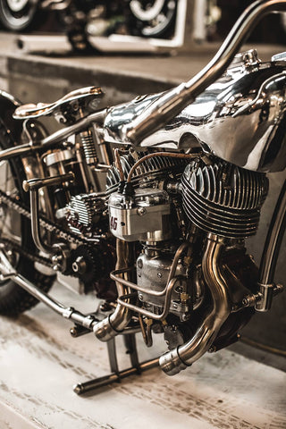 Frame and engine on a polished up vintage chrome moto.