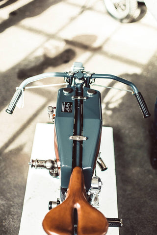 Overhead shot of a custom bike's fuel tank and leather seat.