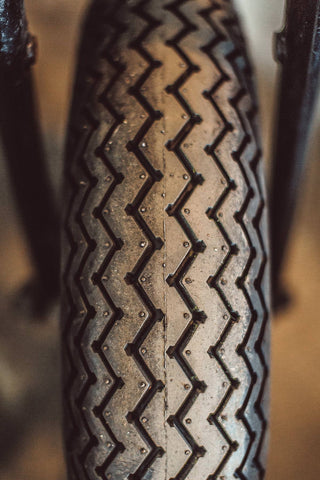 Close up shot of a motorcycle tire treads.