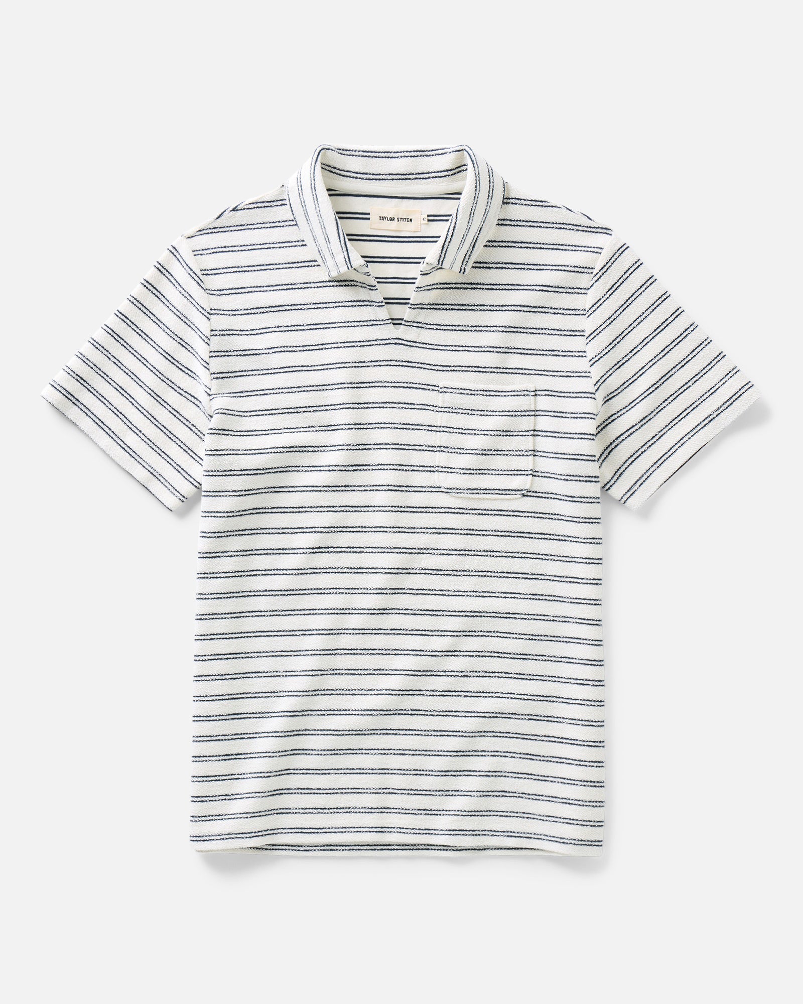 flatlay of The Meridian Polo in Marine Stripe, Knits by Taylor Stitch