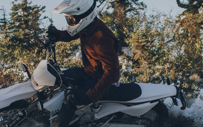 Thrashing an Alta Motors X Taylor Stitch all-electric motorcycle through a snow-dusted forest.