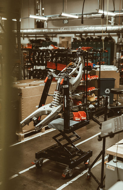 Suspension being assembled on a frame being assembled in the workshop.