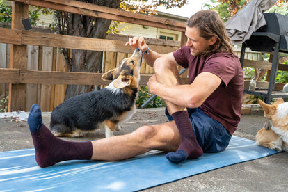 majell stretching next to his dog